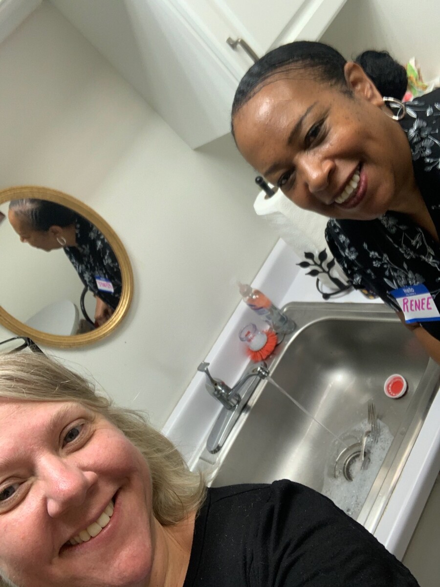 Andria Entsinger and Renee Williams standing in front of the break room sink